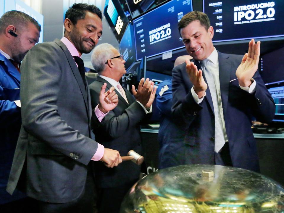 Chamath Palihapitiya, left, is applauded by NYSE president Tom Farley as he rings a ceremonial bell to commemorate the beginning of his company's stock trading on September 14, 2017.