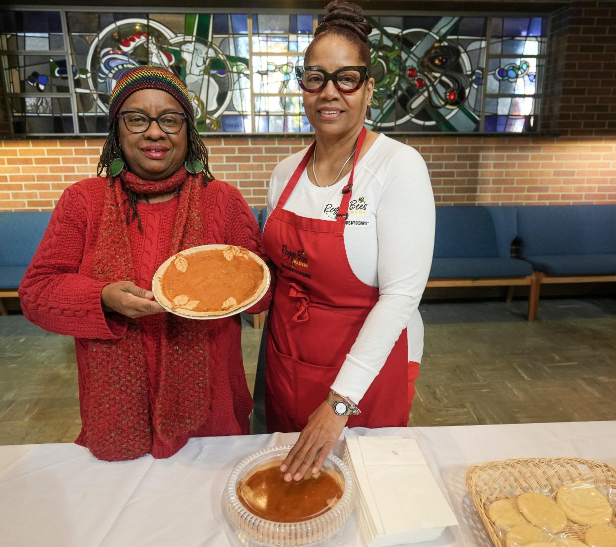 Venice Williams, left, and Neregin Ramsey, owner of Reggi Bee’s Bakery, show their pies Feb. 4 at The Table,  5305 W. Capitol Drive. Williams runs The Table's indoor Winter Farmers Market, and she planned a sweet potato pie contest Feb. 18. Ramsey, who is one of the contestants, keeps her mother’s recipes alive. “It’s a little legacy there; I enjoy seeing people smile when they eat my food. I enjoy cooking,” she expressed. “It’s not quantity, it is quality. When you cook with love in it (the food), you get the right response back.”