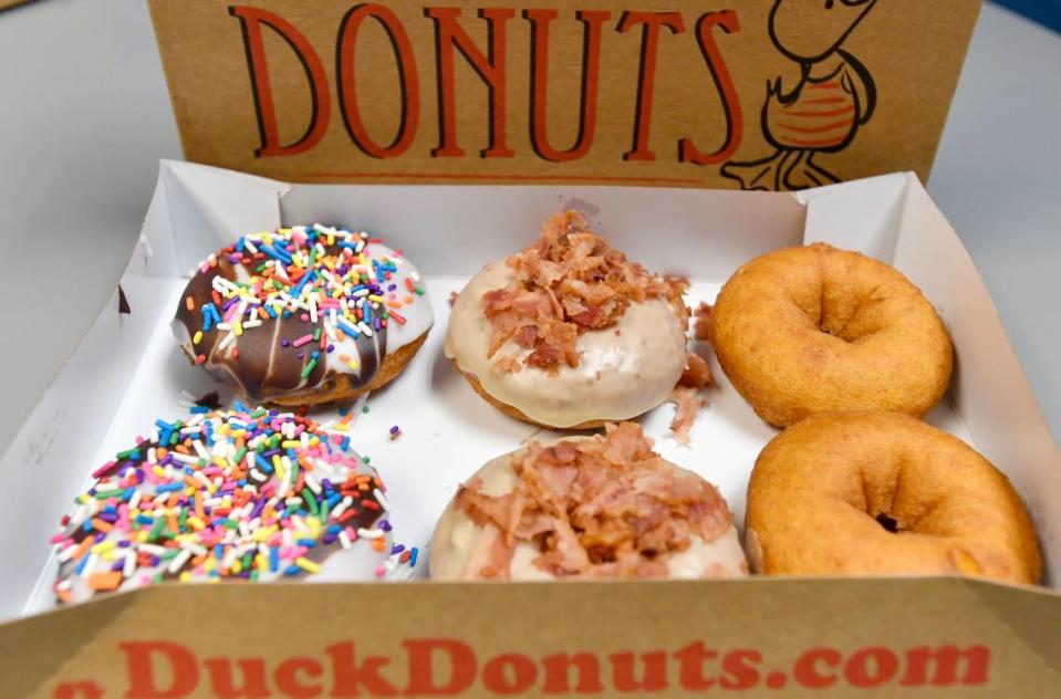 Selections at Duck Donuts in State College include Beach Ball, Maple Bacon and plain doughnuts.