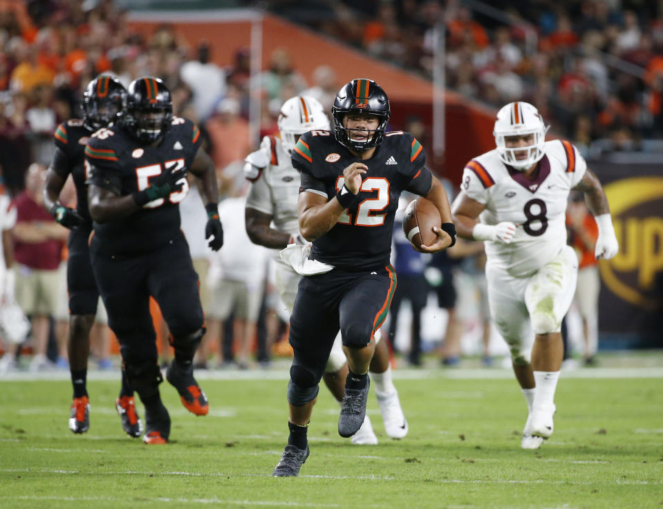 Miami quarterback Malik Rosier (12) runs for yardage during the first half of an NCAA College football game against Virginia Tech, Saturday, Nov. 4, 2017 in Miami Gardens, Fla. (AP Photo/Wilfredo Lee)