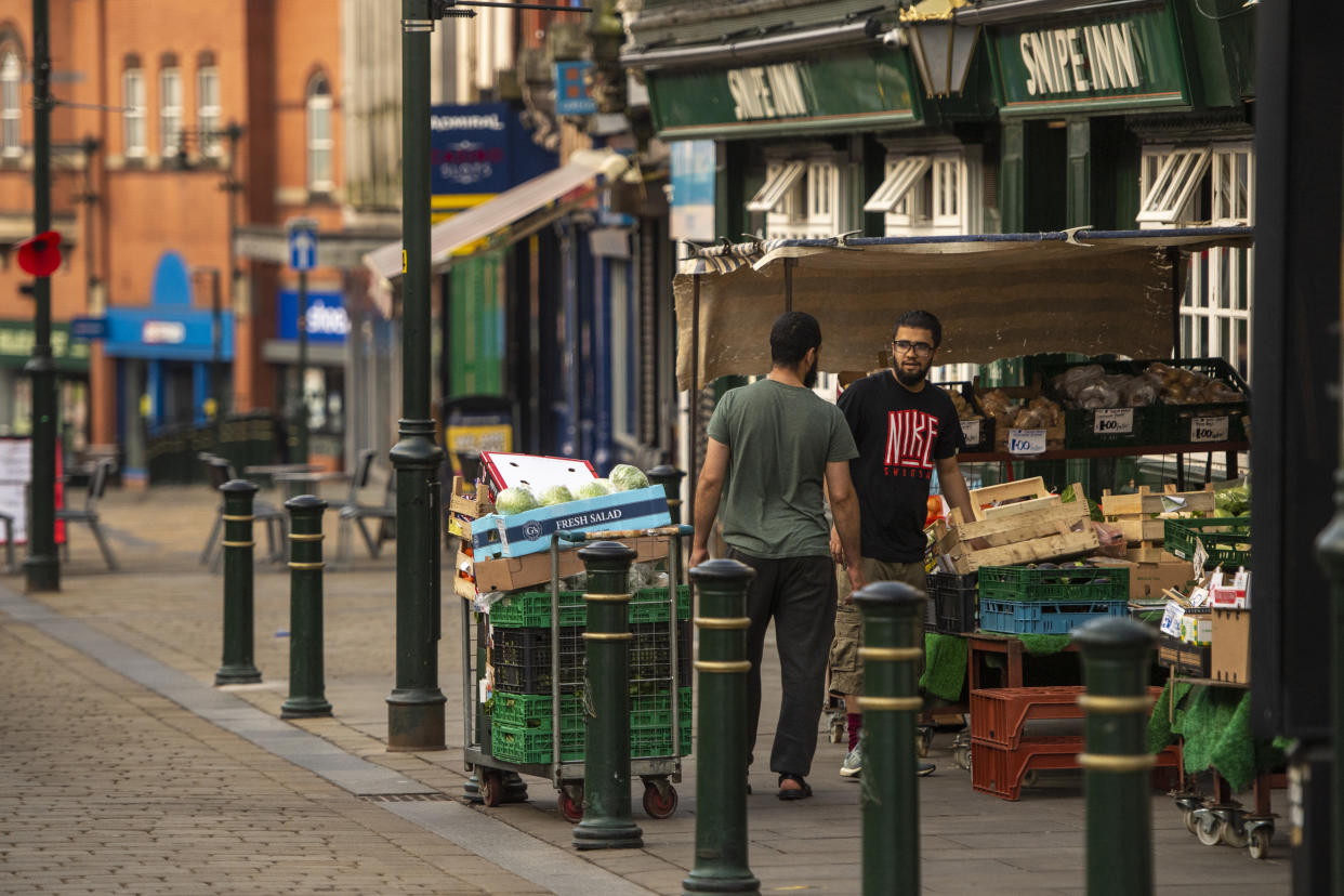 OLDHAM, ENGLAND - AUGUST 13: Shopkeepers prepare to open a grocery shop in Oldham town centre on August 13, 2020 in Oldham, England. The town is on the brink of a local lockdown after a surge in coronavirus cases has left it the worst affected area in England. (Photo by Anthony Devlin/Getty Images)