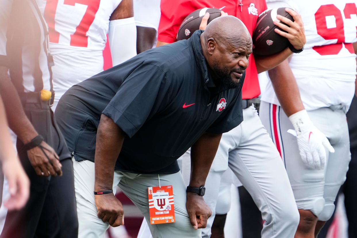 Sep 2, 2023; Bloomington, Indiana, USA; Ohio State Buckeyes defensive line coach Larry Johnson watches warm ups prior to the NCAA football game at Indiana University Memorial Stadium. Ohio State won 23-3.