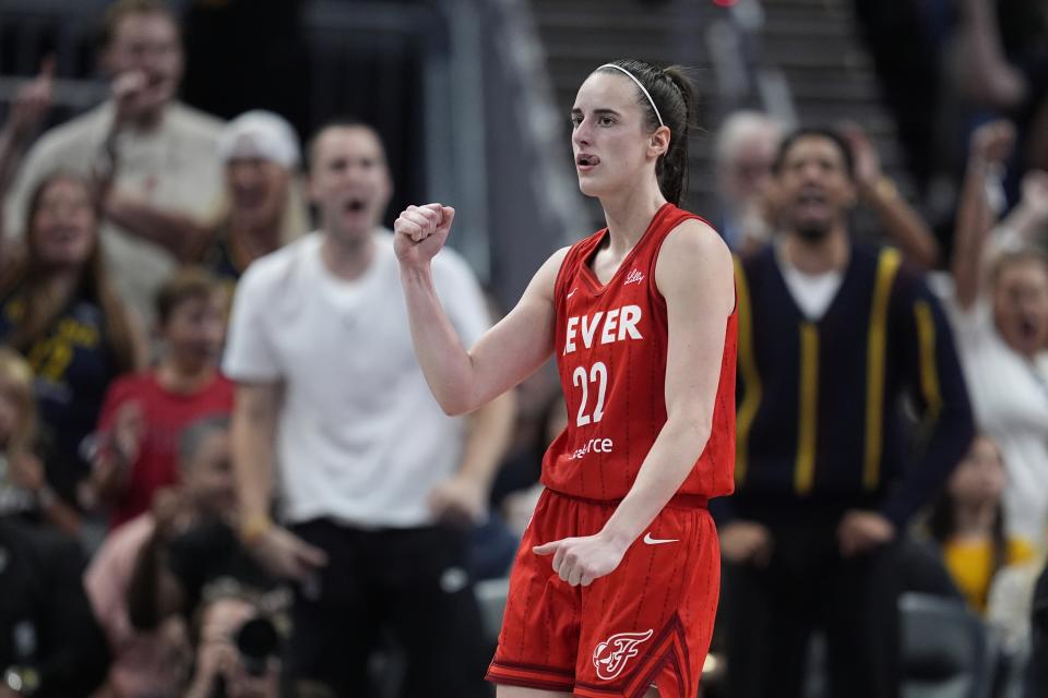 Indiana Fever's Caitlin Clark reacts during the second half of a WNBA basketball game against the Las Vegas Aces, Wednesday, Sept. 11, 2024, in Indianapolis. (AP Photo/Darron Cummings)