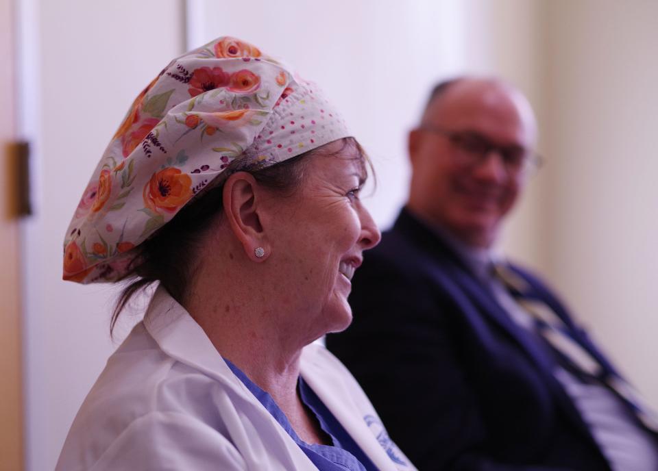 Elizabeth Brady of Brockton, a veteran nurse at Good Samaritan Hospital, talks about her career and working with colleague Dr. Scott Stewart, right.