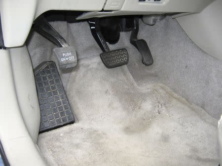 FILE PHOTO: The brake pedal and accelerator from a 2008 Toyota Prius owned by James Sikes is shown in this investigators photograph after a California Highway Patrol (CHP) officer assisted Sikes in stopping the vehicle along Intersate 80 near El Cajon, California in this March 8, 2010 handout photo released to Reuters on March 17, 2010. REUTERS/California Highway Patrol/Handout