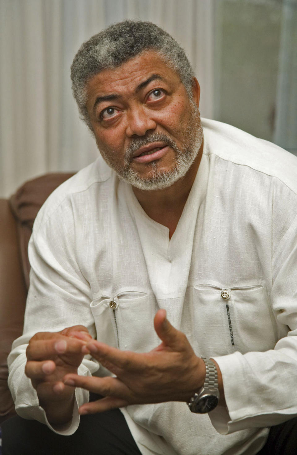 FILE - In this Monday, March 5, 2007 file photo, former Ghanaian coup leader and president Jerry Rawlings is seen during a press interview in Accra, Ghana. Ghana's former president Jerry Rawlings, who staged two coups and later led the West African country's transition to a stable democracy, has died aged 73, according to the state's Radio Ghana and the president Thursday, Nov. 12, 2020. (AP Photo/Olivier Asselin, File)