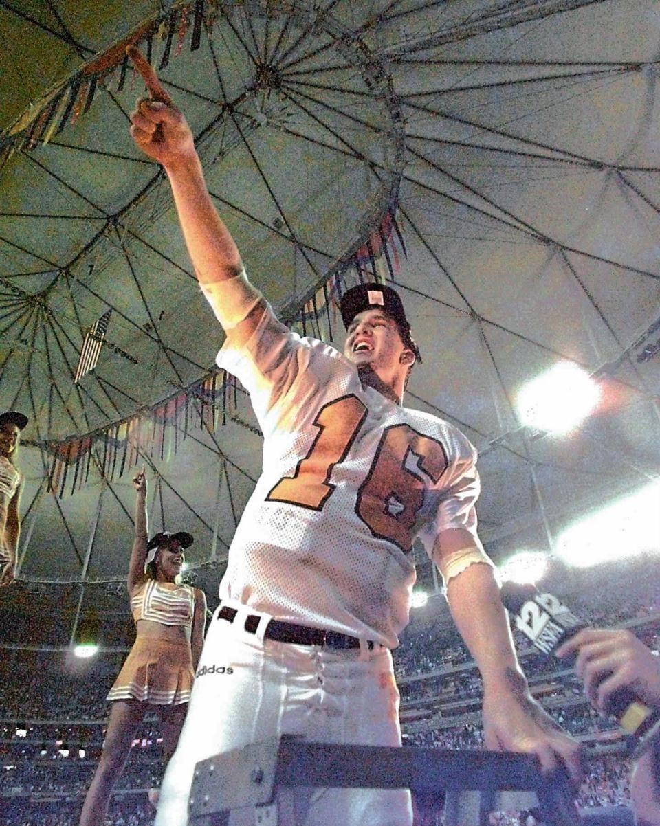 Tennessee quarterback Peyton Manning conducts the Pride of the Southland Band as they play "Rocky Top" to celebrate Tennessee's 30-29 SEC Championship win over Auburn in Atlanta Saturday, Dec. 6, 1997. (AP Photo/John Bazemore)