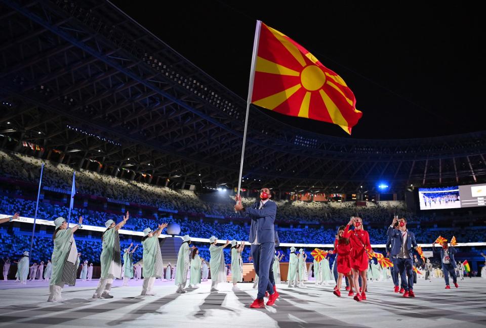 Flag bearers Arbresha Rexhepi and Dejan Georgievski of Team North Macedonia during the opening ceremony.