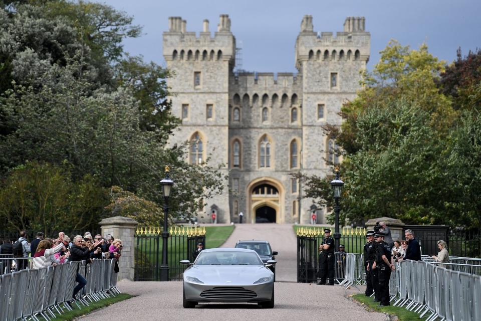 The couple drove an Aston Martin DB10, the same car James Bond drove in Spectre, to their reception.