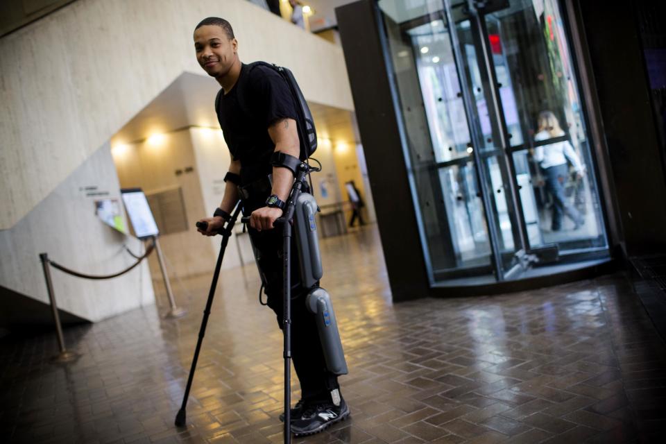 Samuels pauses to pose for portrait while walking with a ReWalk electric powered exoskeletal suit during a therapy session at the Mount Sinai Medical Center in New York City