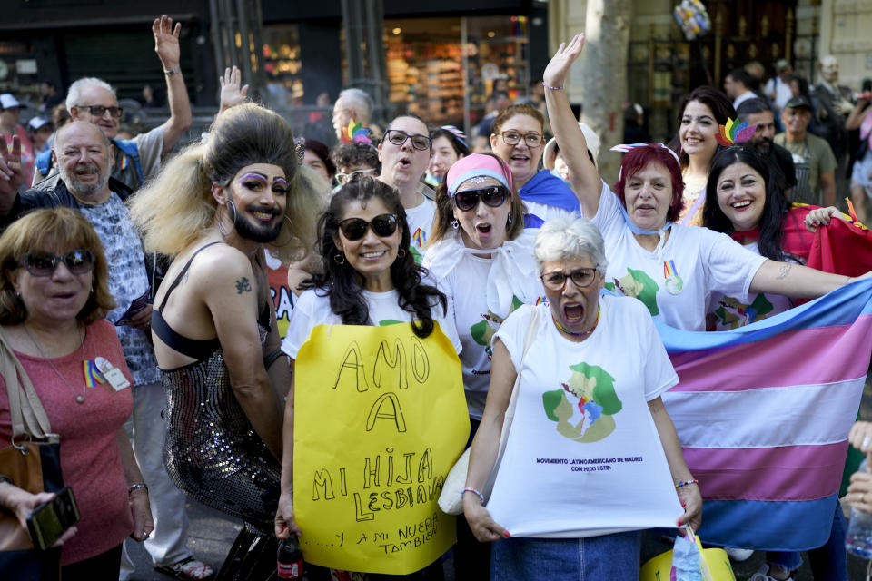 Members of the Latin American Movement of Mothers of LGTB+ Children pose for a group photo during a march in Buenos Aires Argentina, Saturday, Nov. 5, 2022. The organization, which had its first in-person meeting in Buenos Aires, seeks to help mothers that are dealing with discrimination as a result of their sexually diverse children by uniting them with others who may have lived through a similar experience. (AP Photo/Natacha Pisarenko)