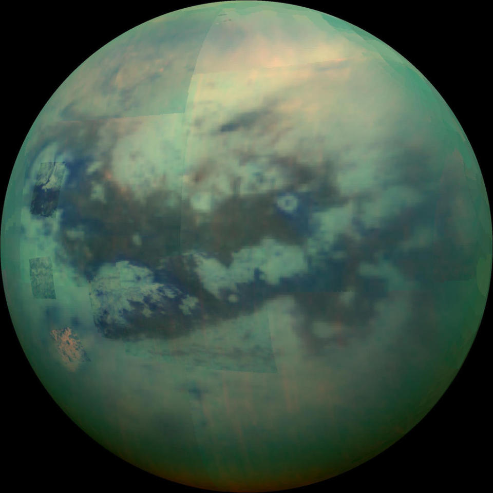 An infrared view of Saturn’s largest moon, Titan, peers through its haze. <cite>NASA/JPL/Space Science Institute</cite>