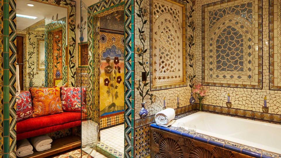 A colorfully-tiled bathroom at Inn of the Five Graces, voted one of the best city hotels in the United States