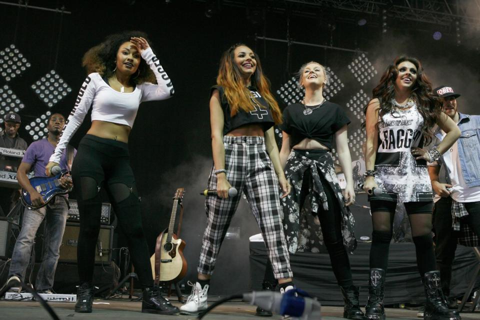 FILE - In this June 15, 2013 file photo, from left, Liegh-Anne Pinnock, Jade Thirlwall, Perrie Edwards and Jesy Nelson of Little Mix perform at Isle of Wight Festival in Newport on the Isle of Wight. Little Mix is one of a new crop of girl groups currently on the music scene. (Photo by Jim Ross/Invision/AP, File)