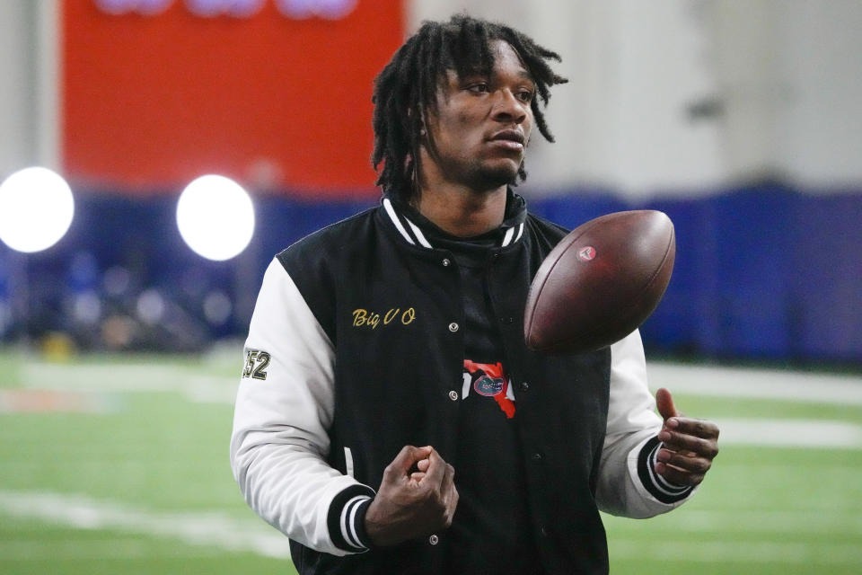 FILE - Florida quarterback Anthony Richardson tosses a ball around during NFL football Pro Day, March 30, 2023, in Gainesville, Fla. Richardson is most intriguing prospect in the class, with Cam Newton-type size, athleticism and arm strength. The mechanics need work to fix accuracy issues. (AP Photo/John Raoux, File)