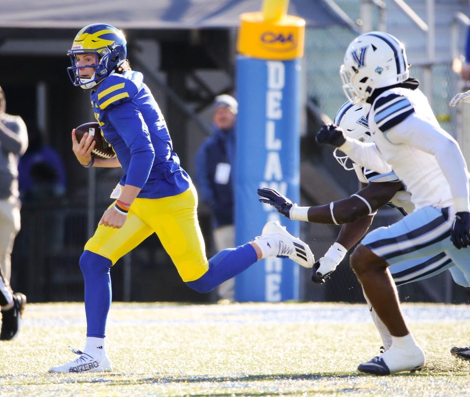 Delaware quarterback Nick Minicucci takes off on foot late in the second quarter against Villanova at Delaware Stadium, Saturday, Nov. 18, 2023.