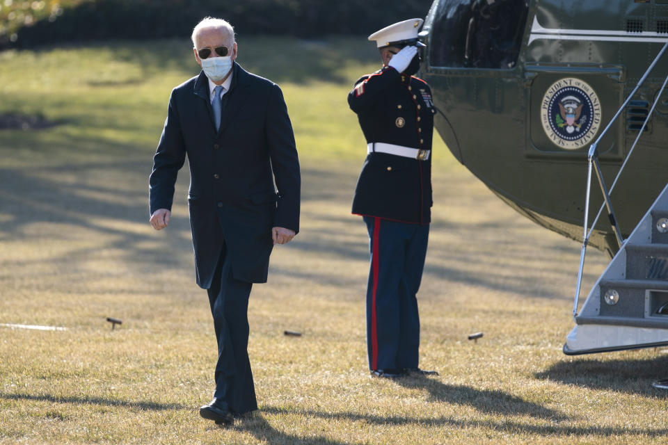 President Joe Biden arrives on the South Lawn of the White House, Monday, Feb. 8, 2021, in Washington. (AP Photo/Evan Vucci)