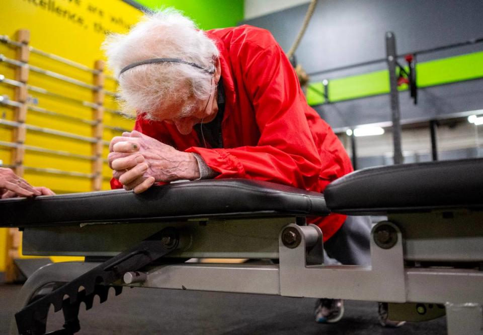 George Etzweiler holds an elevated plank for over a minute during his workout at Ki’netik Fitness on Friday, April 5, 2024.