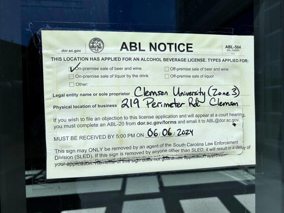 A notice of an application for an alcoholic beverage license posted on a door outside Littlejohn Coliseum, Clemson’s men’s and women’s basketball arena, on Thursday, May 30, 2024 on campus