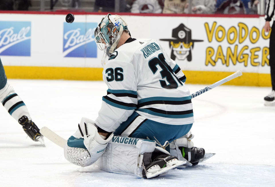 San Jose Sharks goaltender Kaapo Kahkonen stops a shot in the first period of an NHL hockey game against the Colorado Avalanche Tuesday, March 7, 2023, in Denver. (AP Photo/David Zalubowski)