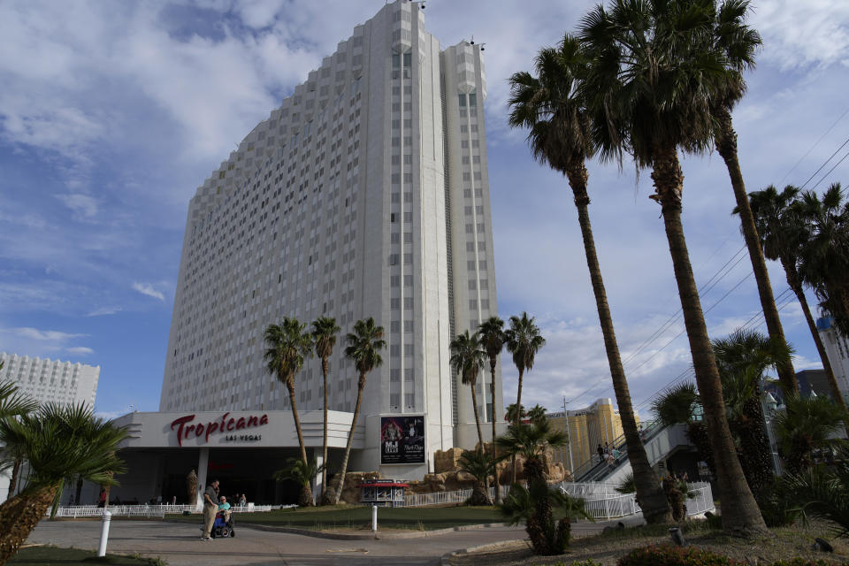 People stand outside of the Tropicana Las Vegas, Tuesday, May 16, 2023, in Las Vegas. Nevada Gov. Joe Lombardo announced Wednesday, May 24, 2023, a tentative agreement between his office, legislative leaders in the state and the Oakland Athletics for a baseball stadium funding plan after weeks of negotiations over how much public assistance the state will contribute to a $1.5 billion ballpark in Las Vegas, according to a joint statement. The bill comes on the heels of the Athletics’ purchase of land on the southern end of the Las Vegas Strip where the Tropicana Las Vegas casino resort sits. (AP Photo/John Locher)