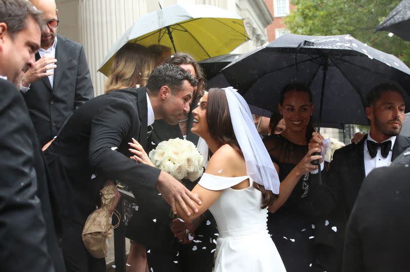 Mario and his wife Becky with Vicky welcoming their friends