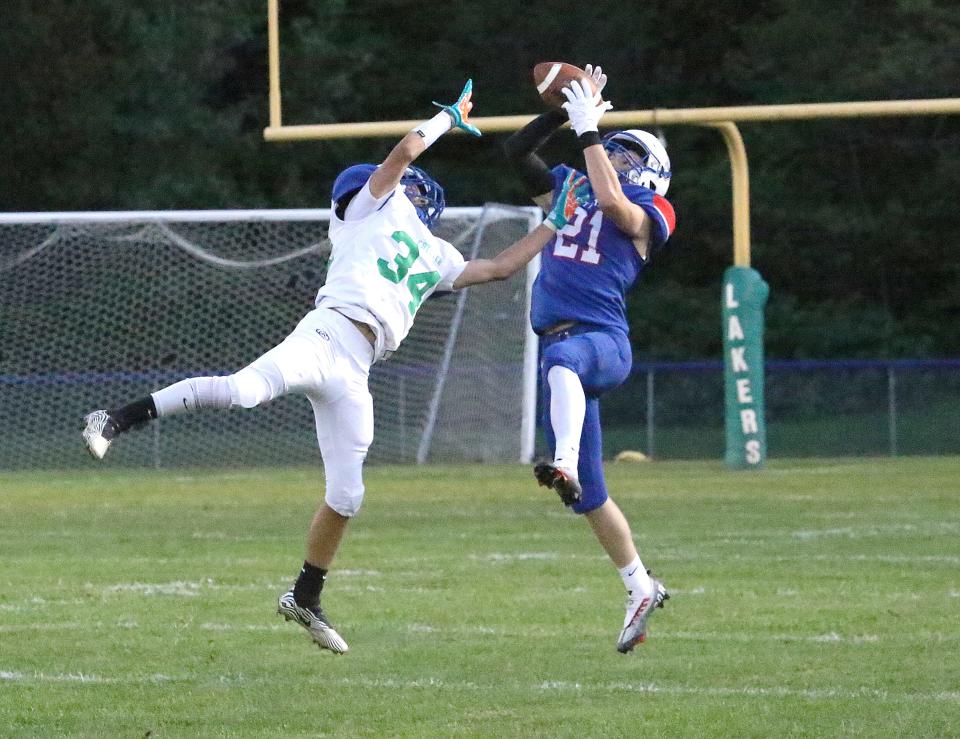 Mount Anthony's Carter Thompson catches a pass during the Patriots season opening 47-20 win over Colchester during the 2022 season.