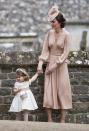 <p>At Pippa Middleton's wedding, Kate wore a blush pink dress and a floral fascinator. As a flower girl, Charlotte also wore a floral head piece and she accented her white dress with a blush pink sash.</p>