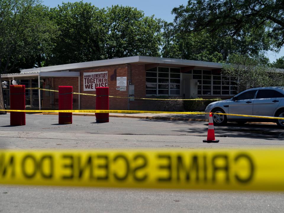 Crime scene tape surrounds Robb Elementary School in Uvalde, Texas, Wednesday, May 25, 2022.