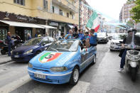 Napoli fans celebrate outside the Diego Maradona stadium in Naples, Italy, Sunday, April 30, 2023. After Napoli's game was moved to Sunday, the team could secure the title in front of their own fans by beating Salernitana — if Lazio fails to win at Inter Milan earlier in the day. Diego Maradona led Napoli to its only previous Serie A titles in 1987 and 1990. (AP Photo/Gregorio Borgia)