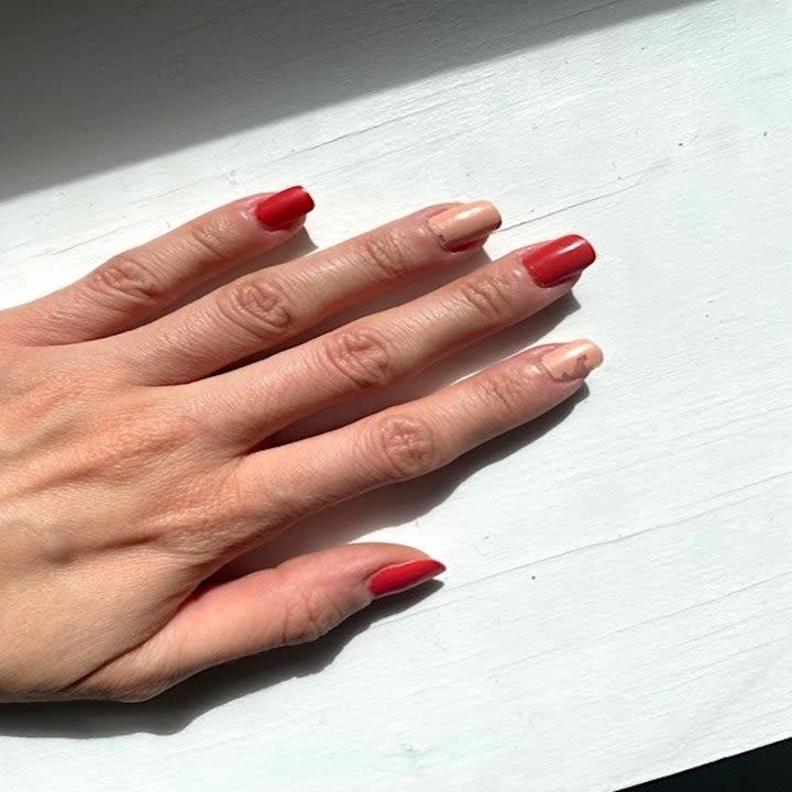 Close up of red and nude nail polish