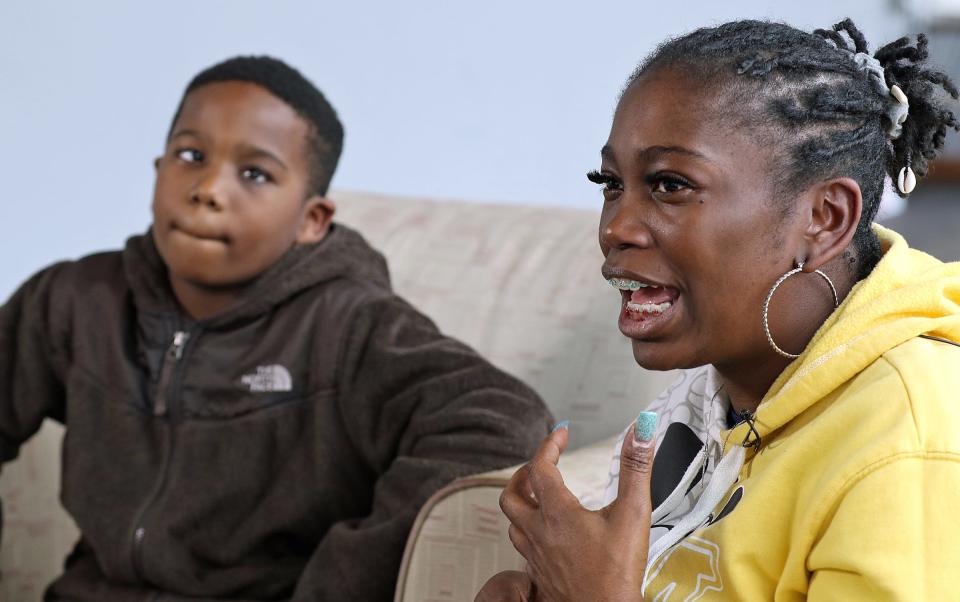 Nine-year-old J.D. Jackson and his mother, Mary Jackson, talk to the media about D.J.’s new eye Thursday afternoon, Dec. 15, 2022, at the offices of the Gaston Gazette.