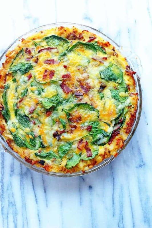 <p>Grandbaby Cakes</p><p>A delightful classic quiche recipe gets an update. This Spinach and bacon hash brown quiche is perfect for your brunch entertaining.</p><p><strong>Get the recipe: <a href="https://grandbaby-cakes.com/spinach-and-bacon-hash-brown-quiche/" rel="nofollow noopener" target="_blank" data-ylk="slk:Spinach and Bacon Hash Brown Quiche;elm:context_link;itc:0;sec:content-canvas" class="link ">Spinach and Bacon Hash Brown Quiche</a></strong></p>