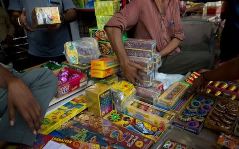 Tens of thousands of firecrackers are sold and set off every year  - Credit: AP