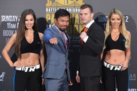 Boxers Manny Pacquiao of the Philippines and Australia's Jeff Horn stand together following their official news conference ahead of their WBO welterweight fight in Brisbane, Australia June 28, 2017. AAP/Dave Hunt/via REUTERS