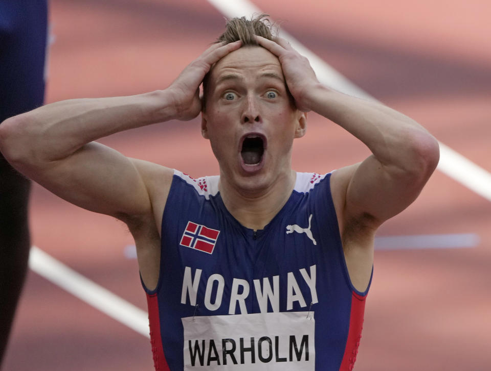 Karsten Warholm, of Norway celebrates as he wins the gold medal in the final of the men's 400-meter hurdles at the 2020 Summer Olympics, Tuesday, Aug. 3, 2021, in Tokyo, Japan. (AP Photo/Charlie Riedel)