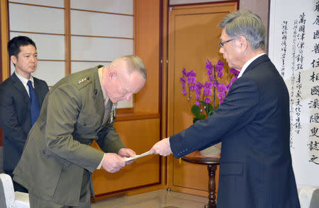 Lt. Gen. Lawrence Nicholson (2nd L), top commander of U.S. military forces in Okinawa, receives a letter of protest from Okinawa Governor Takeshi Onaga during their meeting at the prefectural government office in Naha, Okinawa prefecture, Japan, in this photo taken by Kyodo on November 20, 2017. Mandatory credit Kyodo/via REUTERS