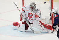 Unted States' Michael Kesselring scores his side's opening goal past Poland's goalkeeper John Murray during the preliminary round match between Poland and United States at the Ice Hockey World Championships in Ostrava, Czech Republic, Friday, May 17, 2024. (AP Photo/Darko Vojinovic)