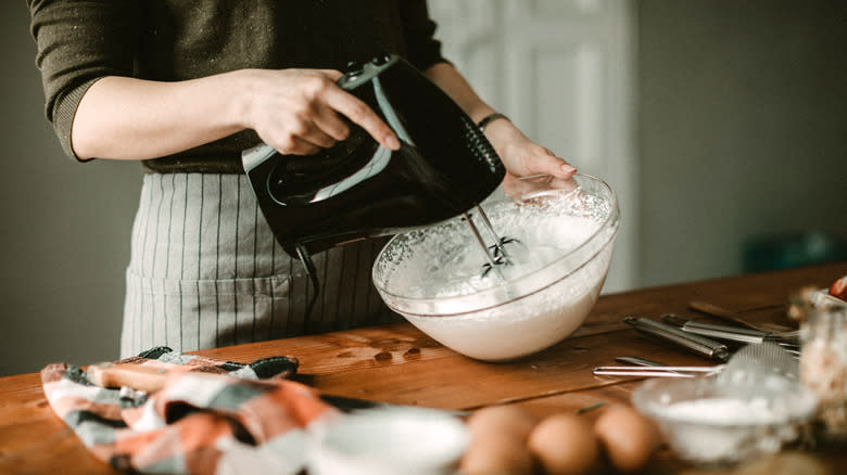 Woman making whipped cream