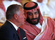 Jordan's King Abdullah II, left, listens to Saudi Crown Prince Mohammed bin Salman, at the Future Investment Initiative conference, in Riyadh, Saudi Arabia, Tuesday, Oct. 23, 2018. The high-profile economic forum in Saudi Arabia is the kingdom's first major event on the world stage since the killing of writer Jamal Khashoggi at the Saudi Consulate in Istanbul earlier this month. (AP Photo/Amr Nabil)