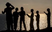 <p>Ultra-Orthodox Jewish boys pray along the Mediterranean Sea in the Israeli city of Herzliya, near Tel Aviv, while performing the “Tashlich” ritual on Sept. 28, 2017, during which “sins are cast into the water to the fish”. The “Tashlich” ritual is performed before the Day of Atonement, or Yom Kippur, the most important day in the Jewish calendar, which in 2017 starts at sunset on Sept. 29. (Photo: Jack Guez/AFP/Getty Images) </p>