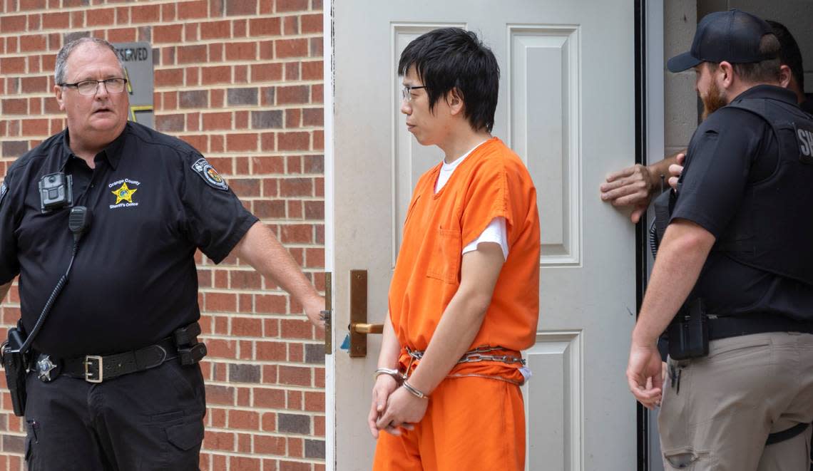 Tailei Qi is escorted out of the Orange County Courthouse following his first court appearance on Tuesday, August 29, 2023 in Hillsborough, N.C. Qi, a graduate student at the University of North Carolina in Chapel Hill, N.C., faces first-degree murder charges in the shooting of a faculty member Dr. Zijie Yan.