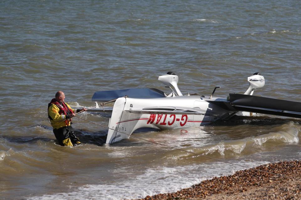 Rescuers managed to bring the aircraft and its two occupants ashore (PA)