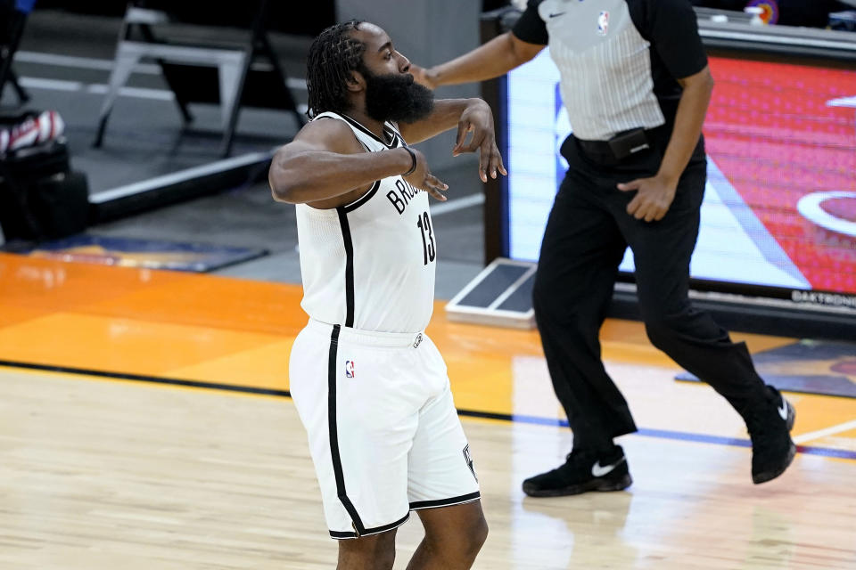 Brooklyn Nets guard James Harden celebrates a 3-pointer against the Phoenix Suns during the second half of an NBA basketball game Tuesday, Feb. 16, 2021, in Phoenix.(AP Photo/Matt York)