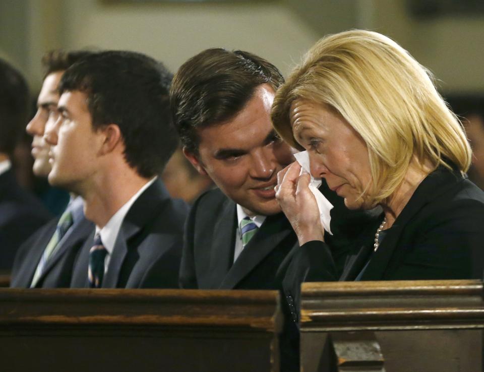 The wife of Canada's former finance minister Jim Flaherty, Christine Elliott (R) and his sons attend his state funeral in Toronto