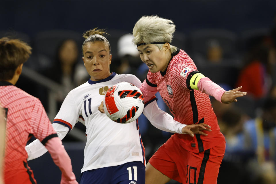 United States forward Mallory Pugh (11) and South Korea midfielder Jl Soyun (10) battle for control of the ball during the second half of an international friendly soccer match in Kansas City, Kan., Thursday, Oct. 21, 2021. (AP Photo/Colin E. Braley)