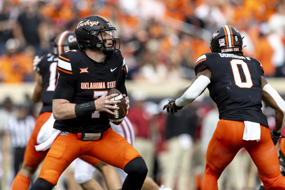 Oklahoma State quarterback Alan Bowman (7) drops back to pass the ball in the first half of an NCAA college football game against Oklahoma Saturday, Nov. 4, 2023, in Stillwater, Okla. (AP Photo/Mitch Alcala)