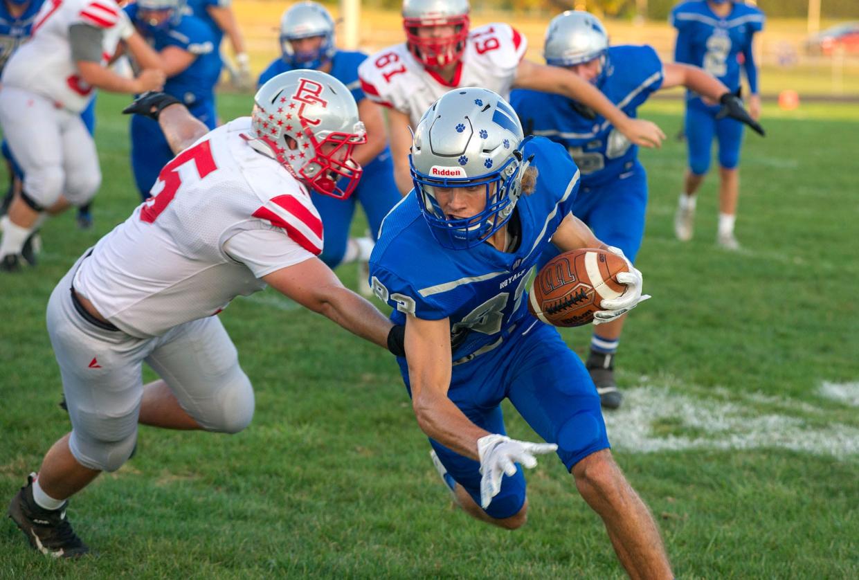 Wynford's Jaron Filliator slips past Buckeye Central's Damian Dean.