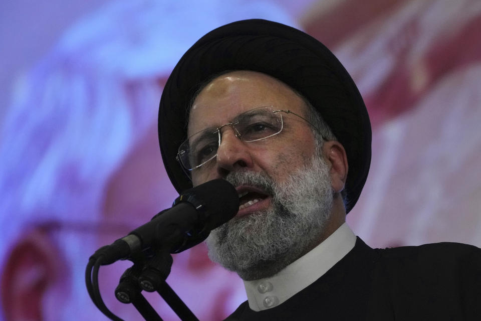 Iranian President Ebrahim Raisi addresses a ceremony marking anniversary of the death of the late Revolutionary Guard Gen. Qassem Soleimani, who was killed in Iraq in a U.S. drone attack in 2020, at Imam Khomeini Grand Mosque in Tehran, Iran, Tuesday, Jan. 3, 2023. President Raisi vowed to avenge the killing of the country's top general, as the government rallied its supporters in mourning amid months of anti-government protests. (AP Photo/Vahid Salemi)