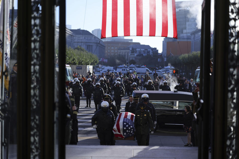 The casket of Senator Dianne Feinstein is carried into San Francisco City Hall in San Francisco on Wednesday, Oct. 4, 2023. Feinstein's casket was then displayt at San Francisco’s City Hall for mourners wishing to say goodbye. It is the building where Feinstein served as a board supervisor and the city's first female mayor before departing for a groundbreaking career in Congress three decades ago. (Gabrielle Lurie/San Francisco Chronicle via AP, Pool)